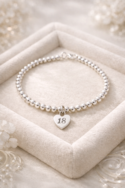 18th birthday keepsake bracelet on a soft velvet background