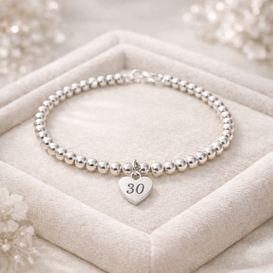 30th birthday keepsake bracelet on a soft velvet background