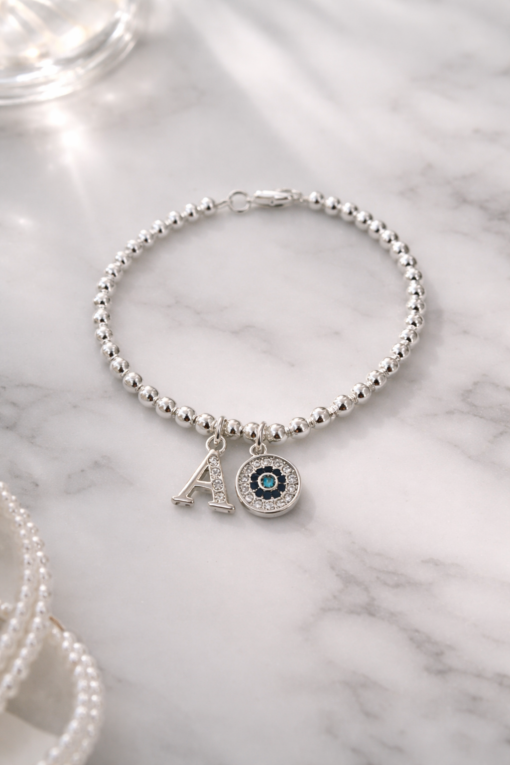 Close up of initial charm bracelet for women