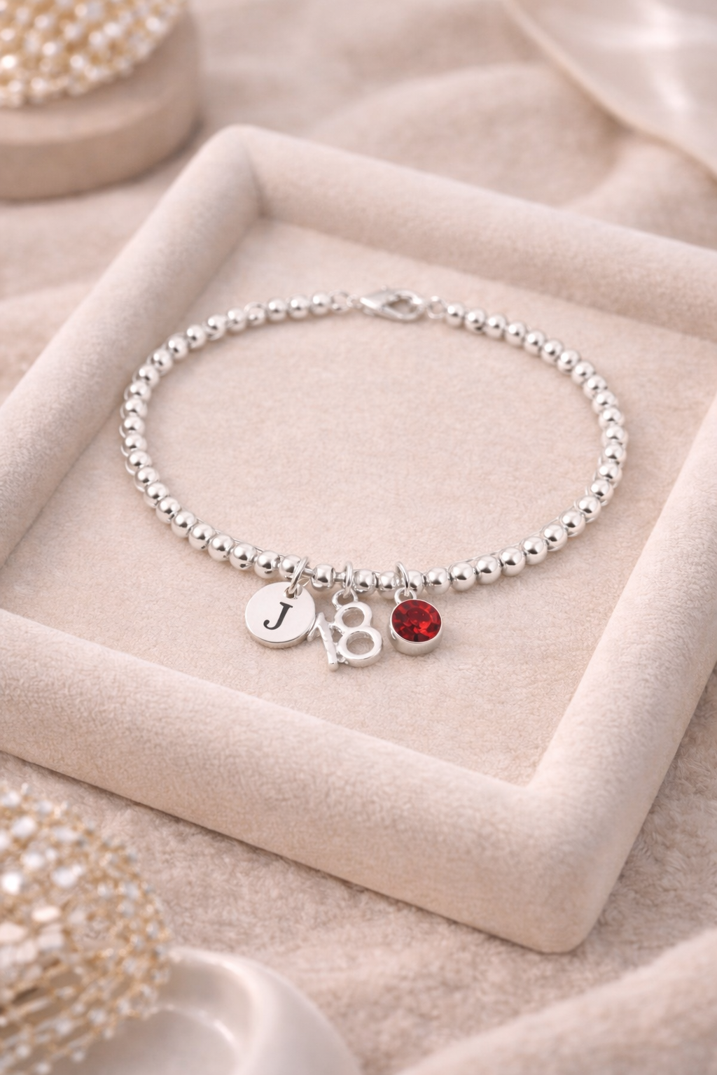 Personalised 18th birthday silver bracelet with initial and birthstone