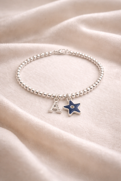 Personalised silver bracelet with evil eye charm