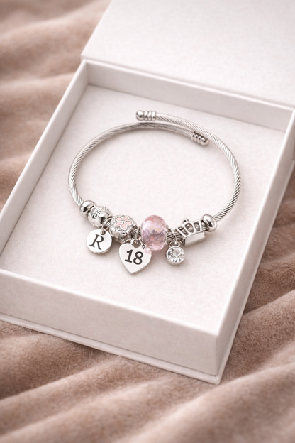 close up silver beaded 18 charm bracelet milestone birthday jewellery