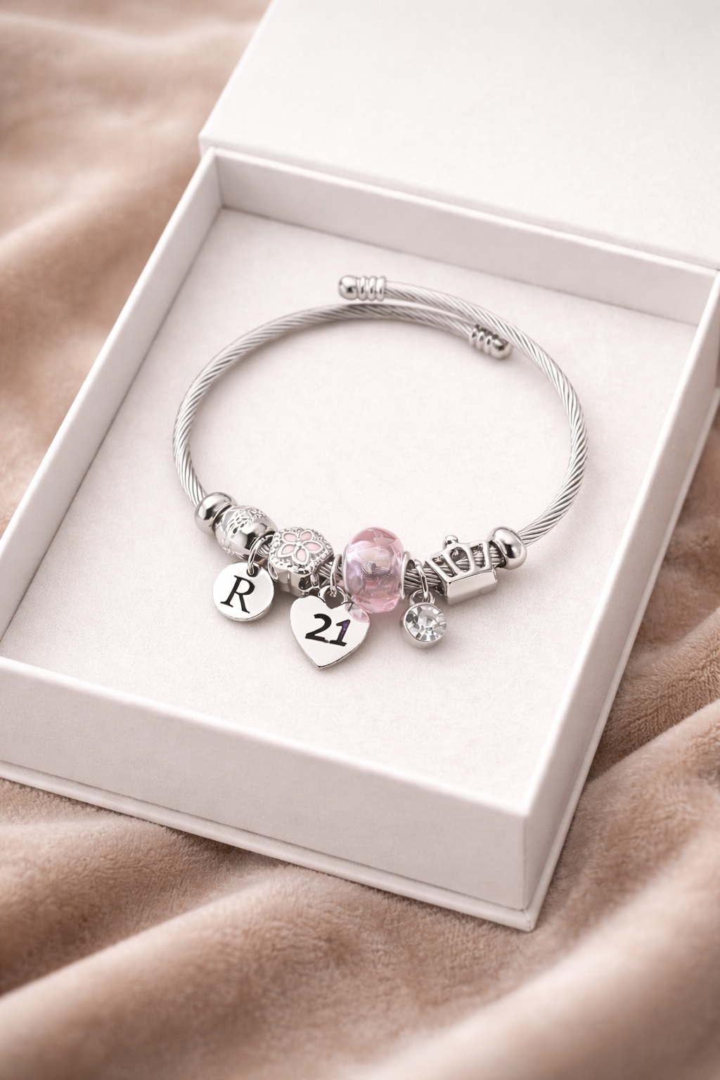 close up silver beaded 21 charm bracelet 